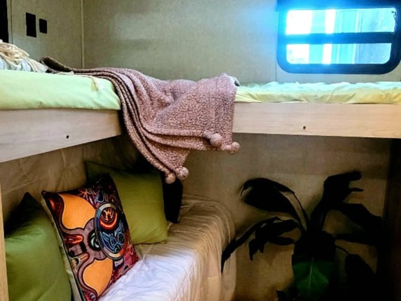 Back room/ bunk beds w Queen trundle bed underneath bunks