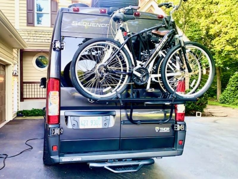 Don't forget the bikes for your adventure!  On the rear of our van is a Thule 2-bike rack!  The design of the bike rack allows the doors to still swing open with the bikes mounted, so you can still have access to the rear of the van!  Genius!  (The rack cannot accommodate e-bikes due to weight limits). 