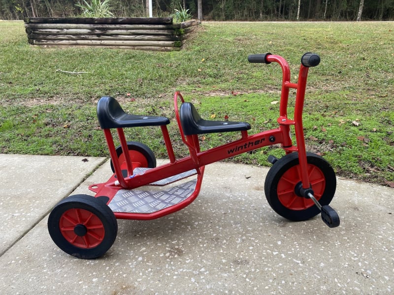 Double tricycle available as an add-on for $15 per trip. Great when you have a 1-2 yr old who wants to ride bikes but can't really do it themselves yet.