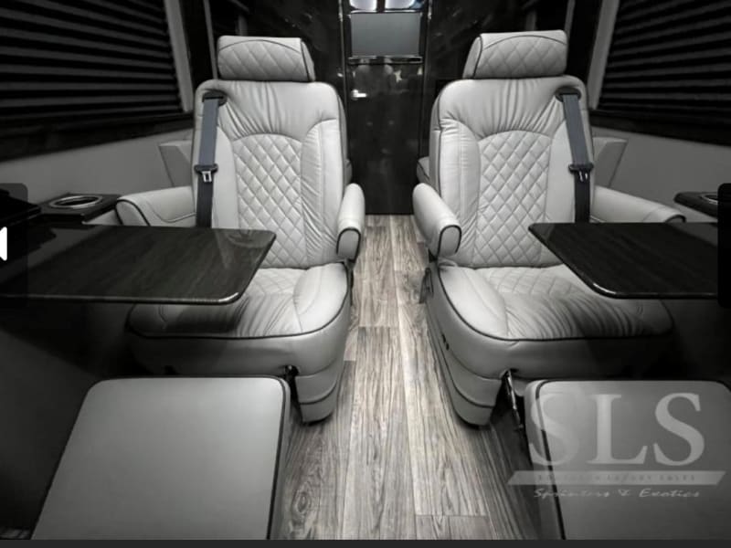 Third row reclining captains chairs with hide away tables