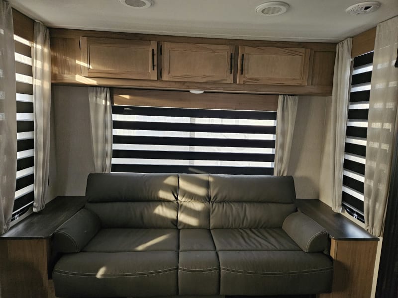  Sofa with Bolster Arm Rests and storage.  Converts into a bed