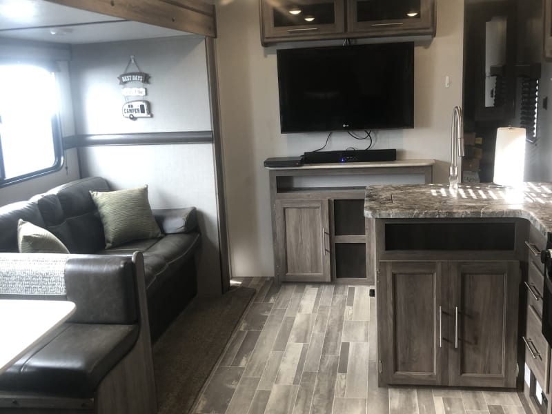 Entertainment Center with TV, DVD Player, and Sound bar.  Jacknife couch folds out to bed. All linens and pillows are provided.