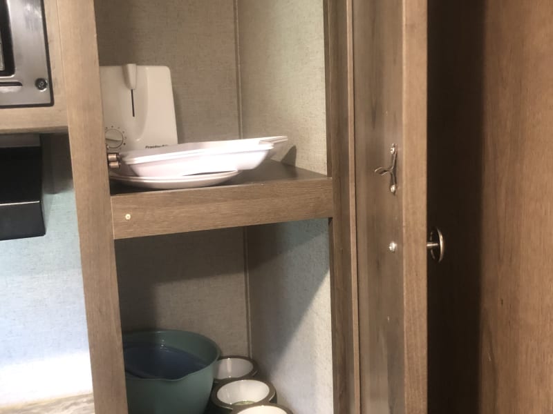 Inside pantry.  Bowls, serving dishes, toaster, blender, coffee pot, pots/pans, utensils, cooking utensils included