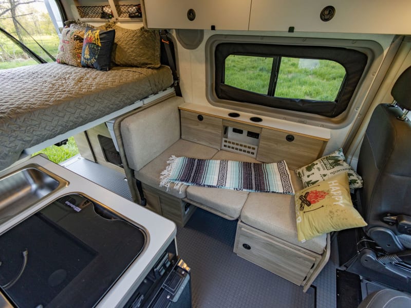 The dinette folds into a sofa and daybed to allow for one more sleeper. 