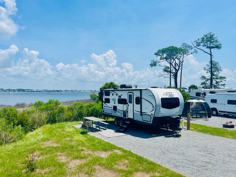 RV parked at St. Andrews State Park in Panama City Beach, Florida.