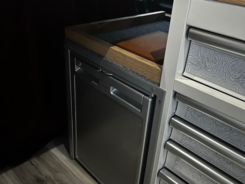 Next to the prep station is a built-in fridge that can hold and keep all your perishables nice and cool