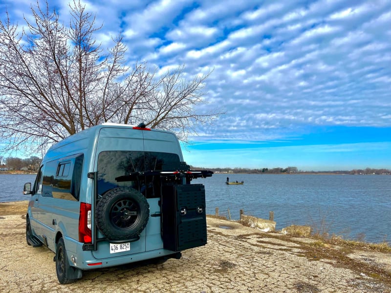 Professionally installed rear spare tire rack as well as a 2-up dual bicycle rack and an XL storage box by the OWL van company. The XL storage box holds your folding chairs, table, power cords, adapters, and other RV accessories.  All included!