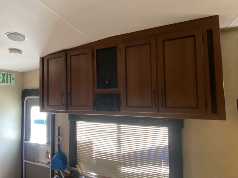 Extra cabinets and music/ dvd control panel. Indoor/ outdoor surround sound. Ceiling mounted pop down 32inch tv. 