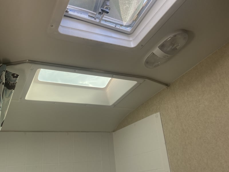 Bathroom ceiling fan and skylight