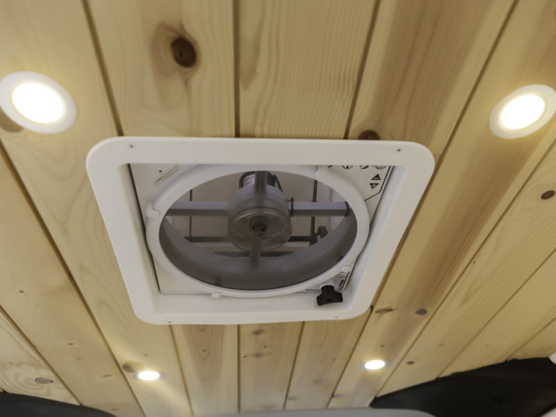 ceiling fan, with auto setting, and reversable direction. pull air in or push air out of the van. 