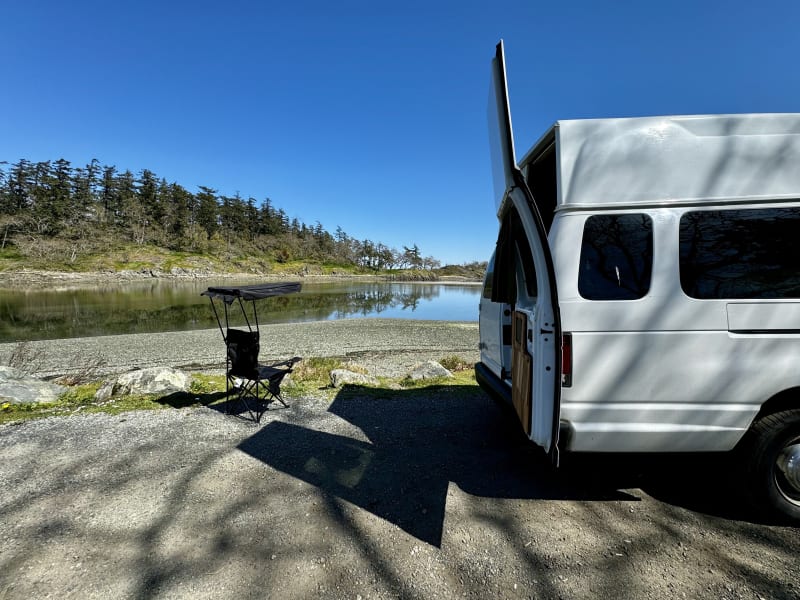 View of the exterior with one of the two included camping chairs.