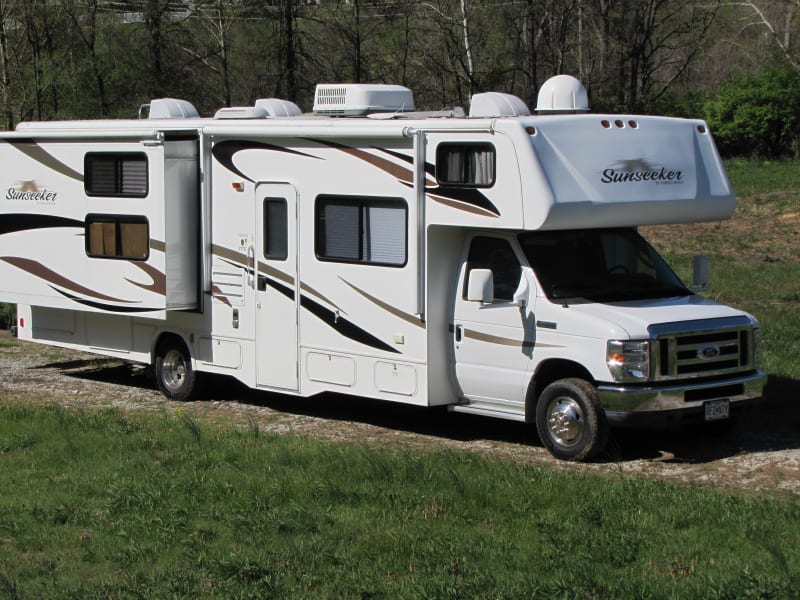 This unit features two slide outs, an over-the-cab sleeping area, ample storage, and is easy to drive. 
