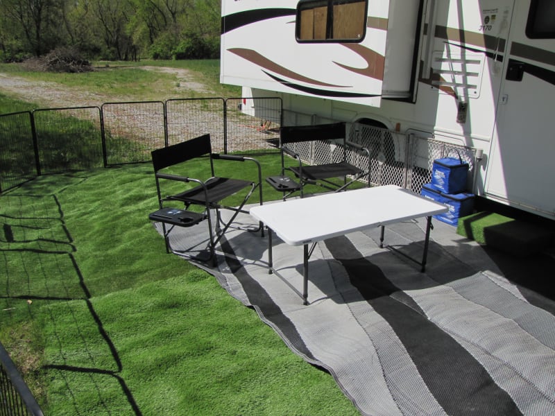 With provided tables and chairs, your outdoor living space options are limitless. Notice the fence system.  This allows your pets to enjoy this experience without being leashed the entire time.  Check with the campground to ensure fence systems are allowed. 