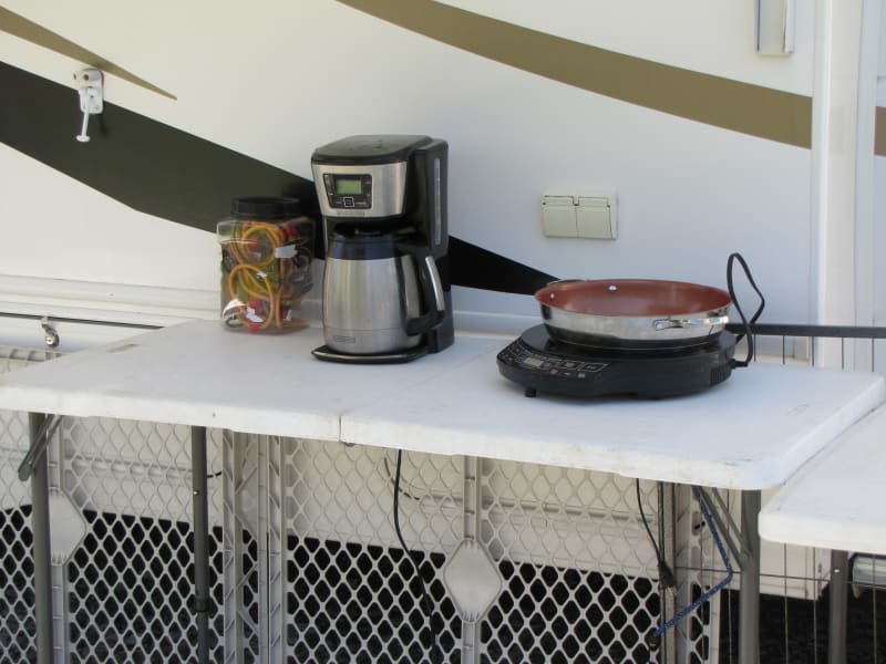 We often prefer to be outside.  This set up is good for outdoor cooking and nice morning coffee.