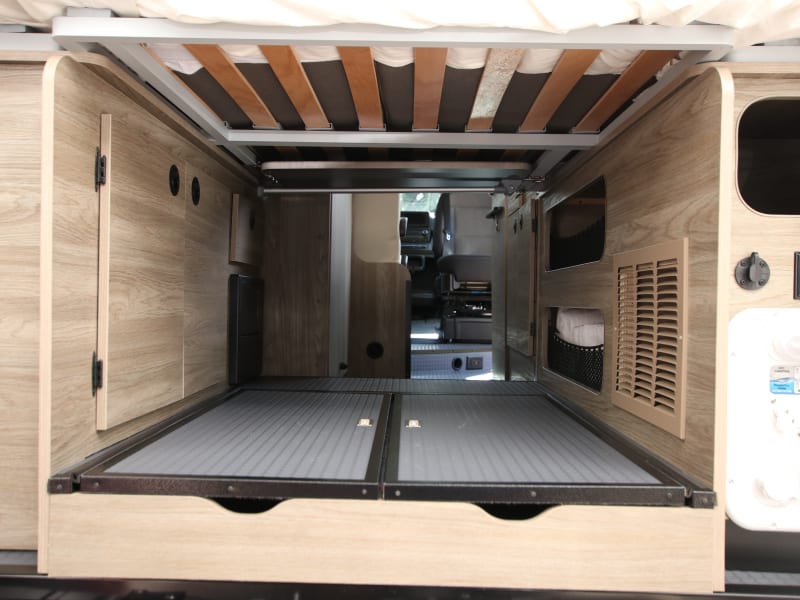 Rear storage under bed, with Murphy bed down.