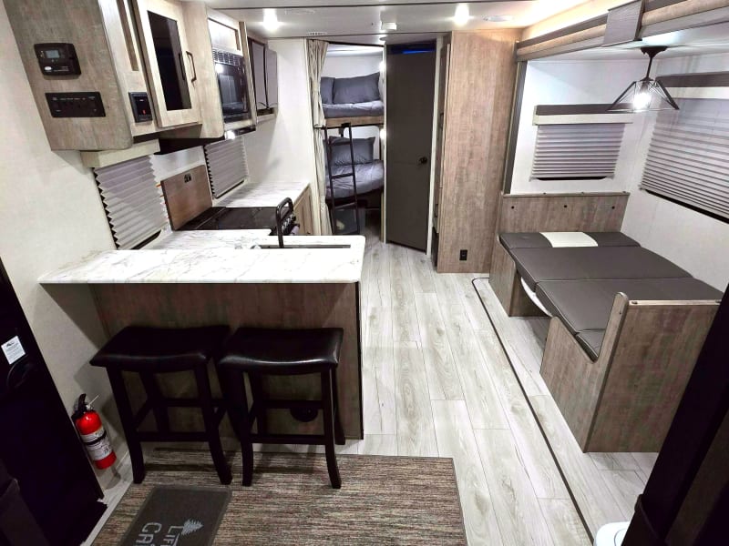 Open floor plan with easy access to kitchen area, dinette area, bunk beds and bathroom. Spacious enough that you don't feel like you are crawling on top of each other. Dinette area can be changed to an additional sleeping area. 