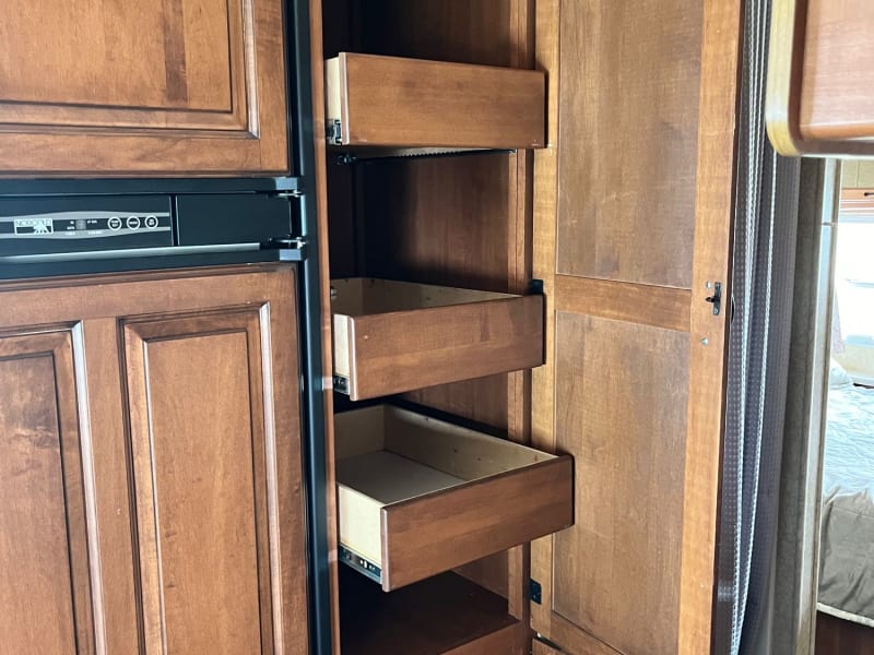Pantry with slider drawers.