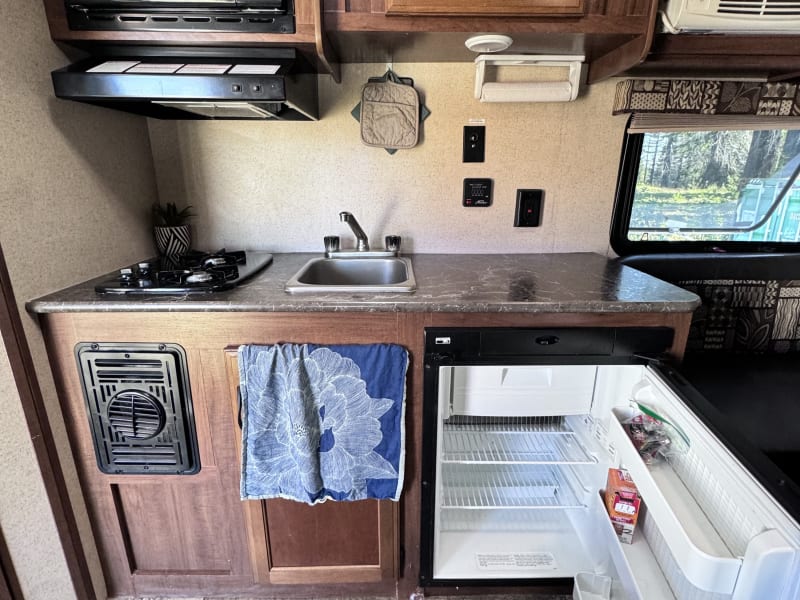 2 burner gas stove, fridge, microwave, sink