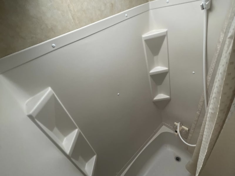 Full stand up shower closed off from living area 