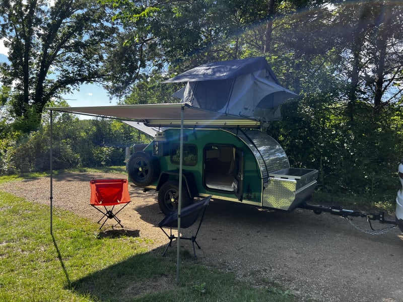 The easy pop-up awning provides shade to relax under.
