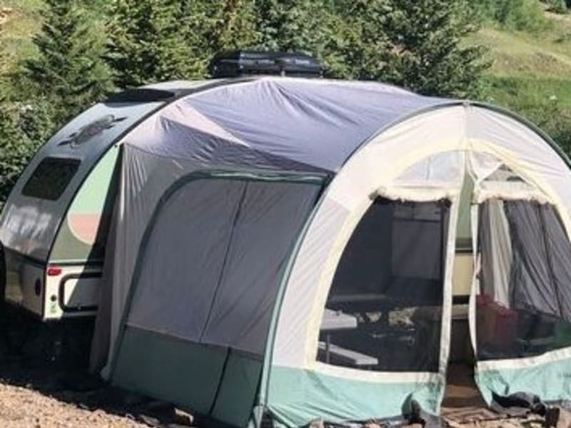 The r-dome attaches to the side instead of an awning, and it is so great because it can be enclosed for privacy, more shade, or to keep bugs out.