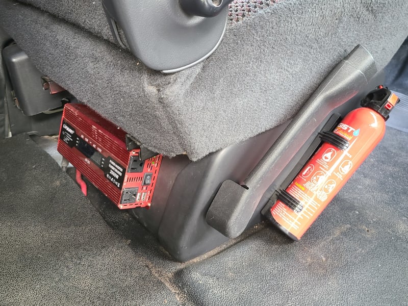 Fire extinguisher and inverter. Inverter will air up the mattress and charge devices, but is NOT intended to be on continuously or for anything other than basic devices.