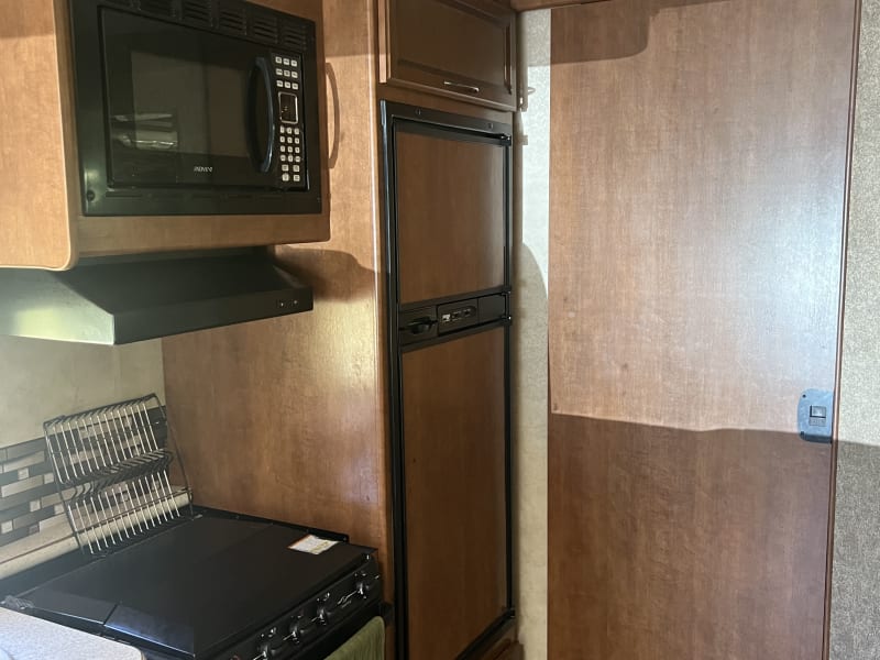 Door slides shut to separate the shower, bathroom, and main bedroom from the rest of the RV for added privacy. 