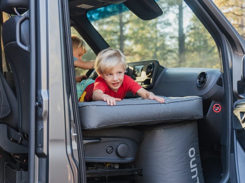 You can OPTIONALLY ADD a LUNO mattress system to this rental to create an additional sleeping area for kids in the front seats. This mattress is an Add-On feature, you must select at checkout. We can also add a SECOND row of seating to accommodate more passengers. 