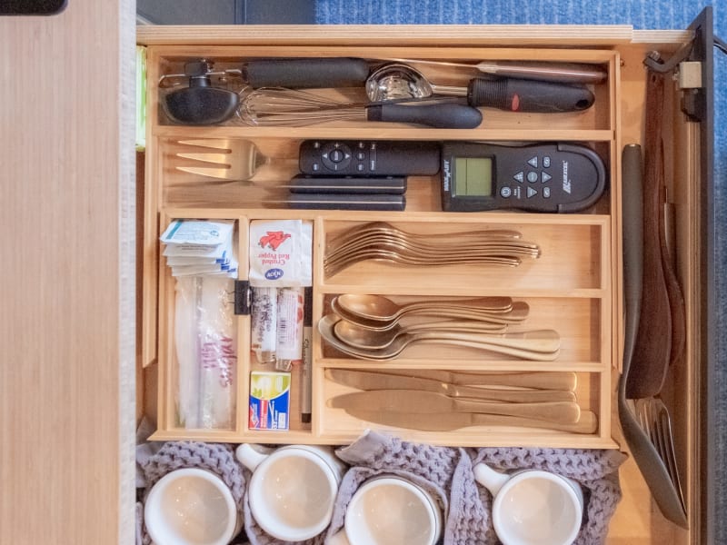 Modern flatware and dishware is included for up to 5 people.