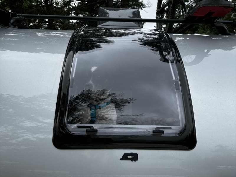 Giant stargazer window for looking at the stars at night or venting the inside of the camper.