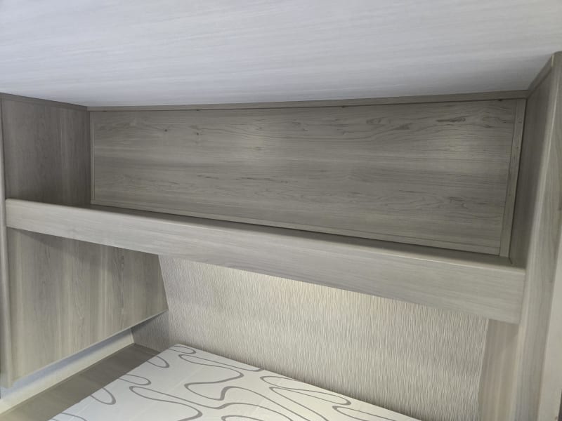 Above bed storage. Cubbies have since been added 