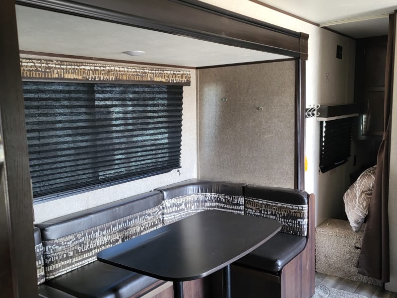 Large u shaped dinette also folds down for extra sleeping for guests.