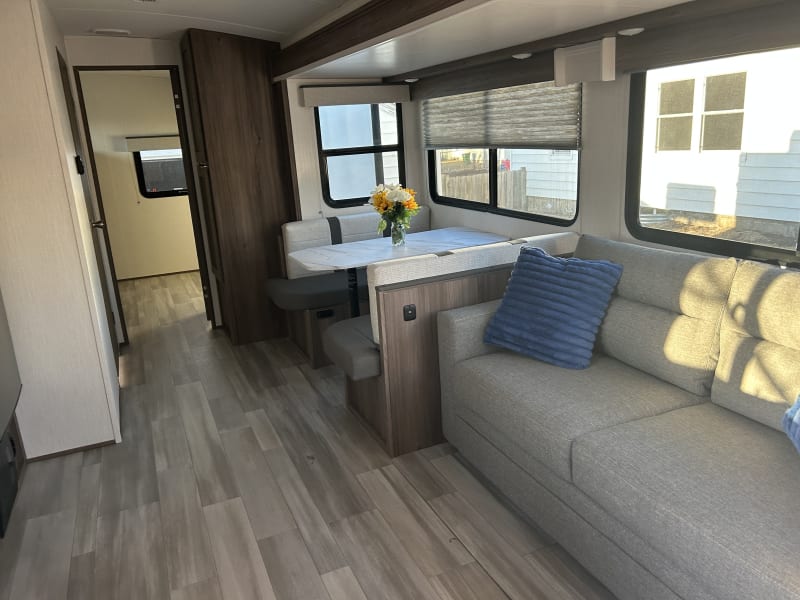 A cozy space for sharing meals.

Dinette and sofa convert into additional sleeping spaces.