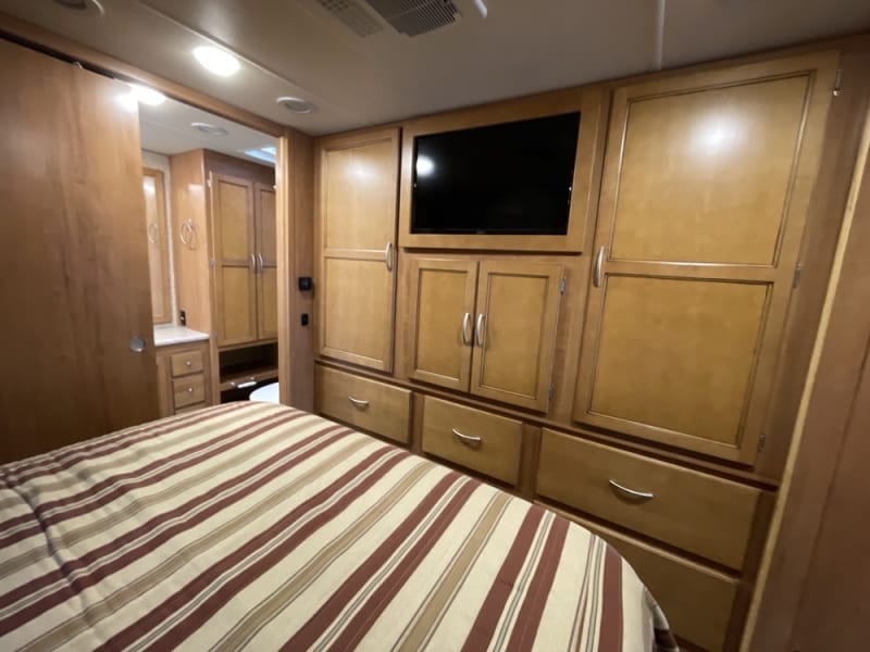 Ample wardrobe/storage, with television, dvd player & satellite tv.