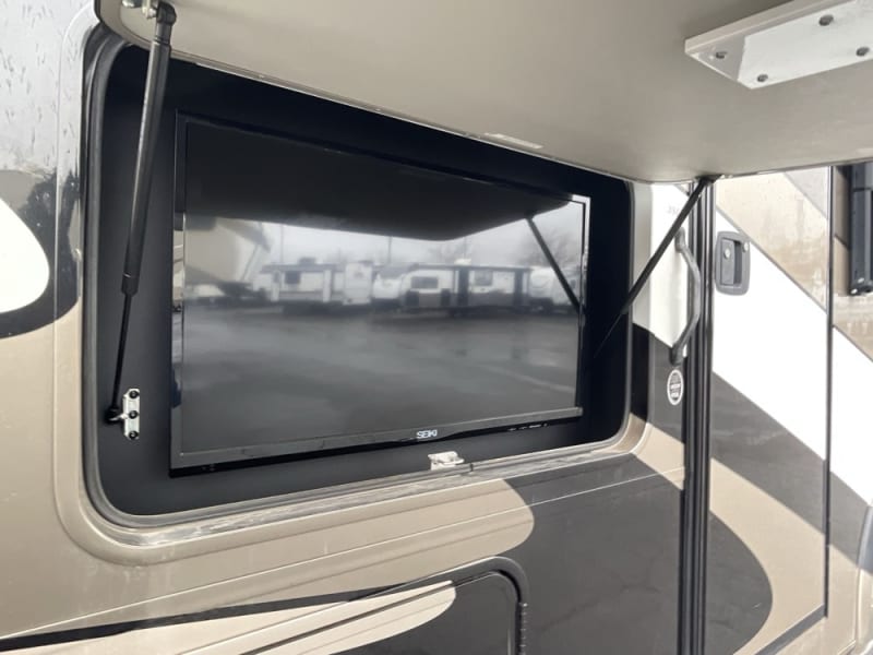 Exterior television. Retractable canopy on both driver & passenger side.