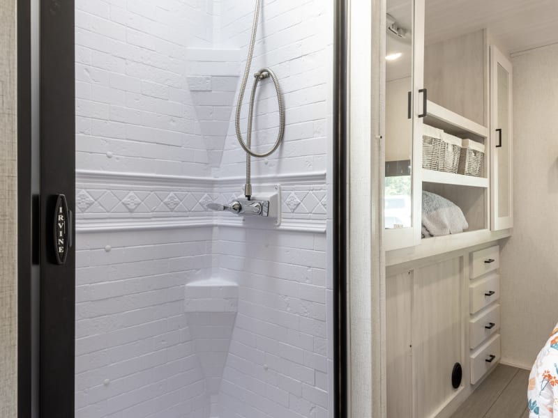Split bath includes a shower on one side of the hall...