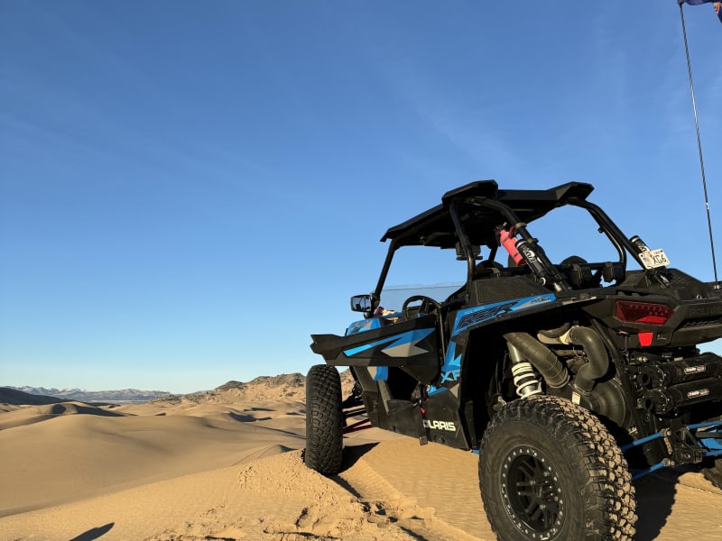 Let's get this added to your trip. Fits in the garage and it'll take you to the moon! Our 2016 RZR Turbo is tuned, tired, exhausted, and ready to make you think twice, basically it's an absolute blast. 
Message me and I can send you the proper link to get her added to your trip.