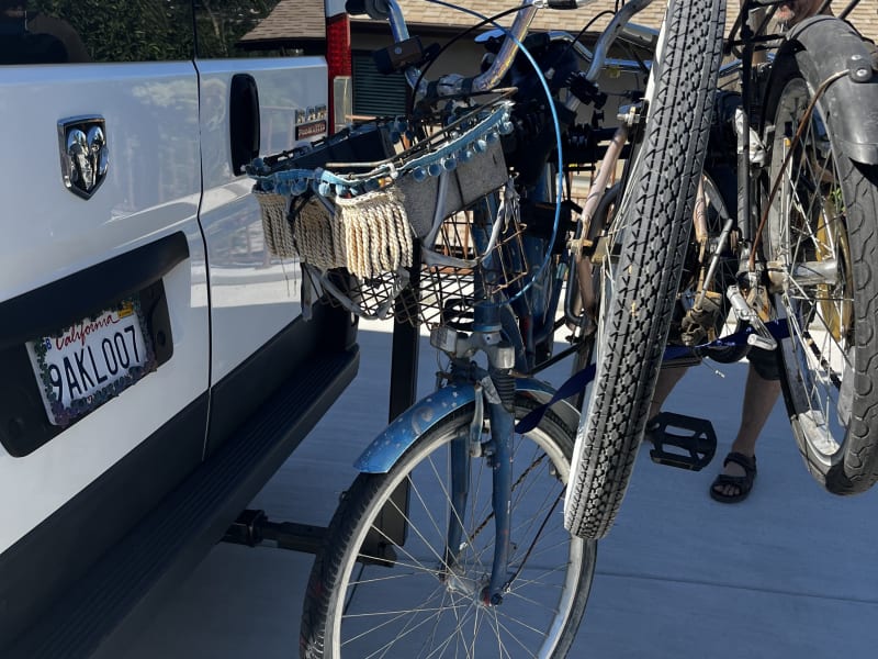 BIKE RACK- available in the ad-ons section. Heavy-duty & up to 4 bikes! Attaches to the tow hitch, it can be folded down when not in use, can also be tilted down while in use to access the back doors. 