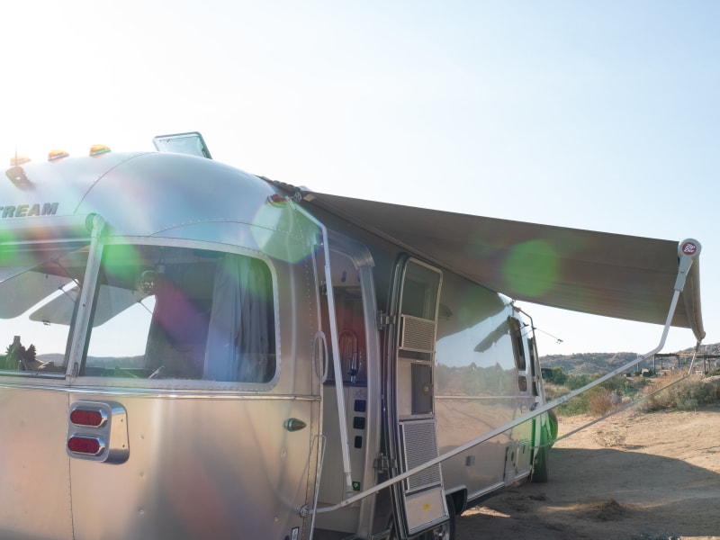 Canopies on both sides and rear of Airstream