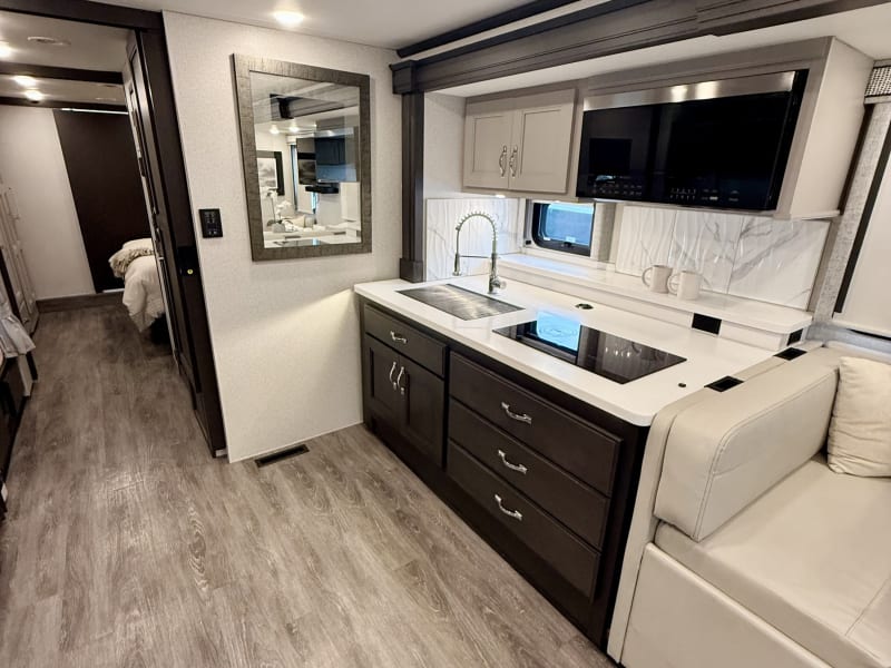 Kitchen, with large sink, microwave, and stove