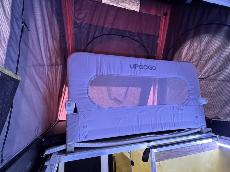 Tent access half closed with child/baby guard.