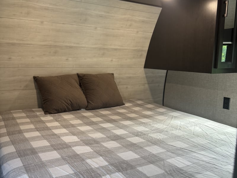 Comfy Queen size with overhead storage, nightstands, hangers, and shelves. Extra storage space under the bed!