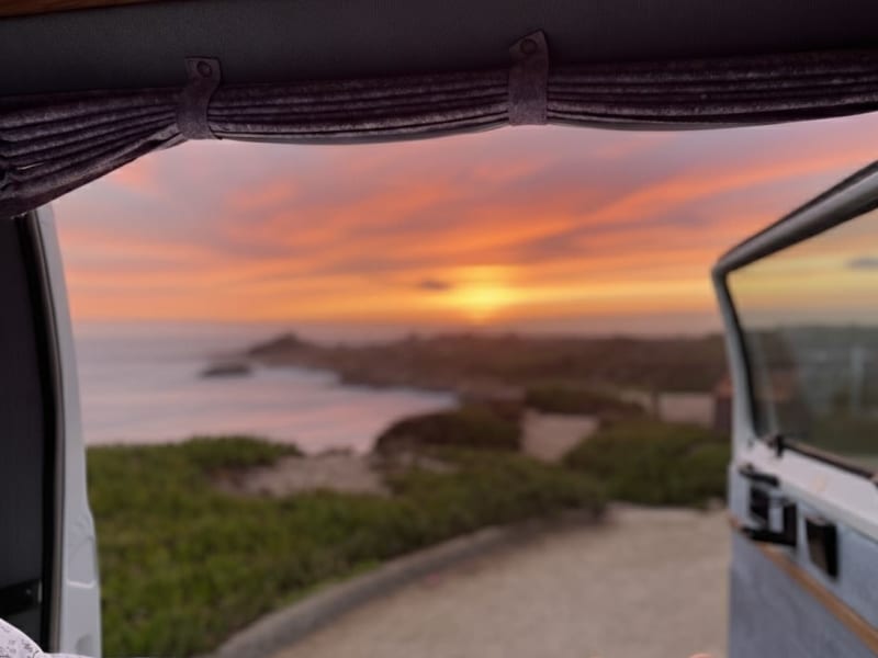 The back door opens full width for views right from the main sleeping area. This picture was take at Bean Hollow Beach on Highway 1.