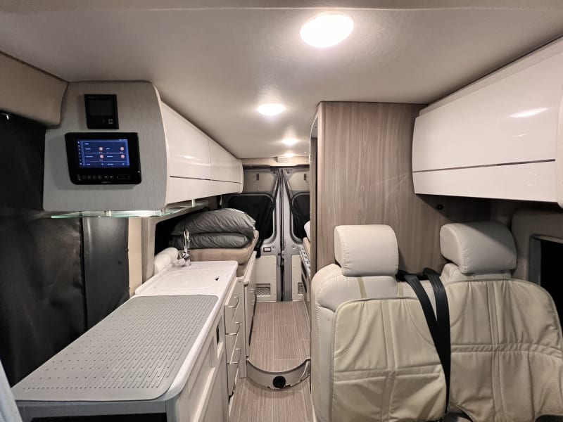 2nd sleeping space: Size twin by pulling the support ledge from right to left at the end of the campervan (where bedding and pillows are located in the picture)