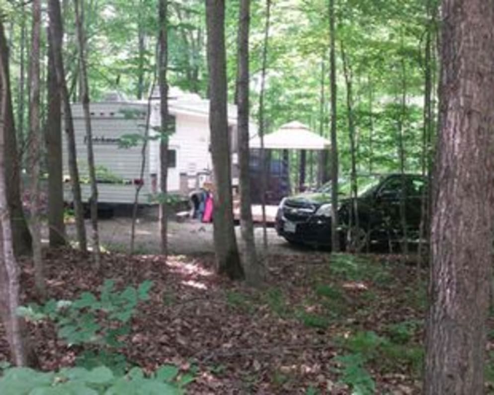 Trailer at campsite with treed lot - very private. 