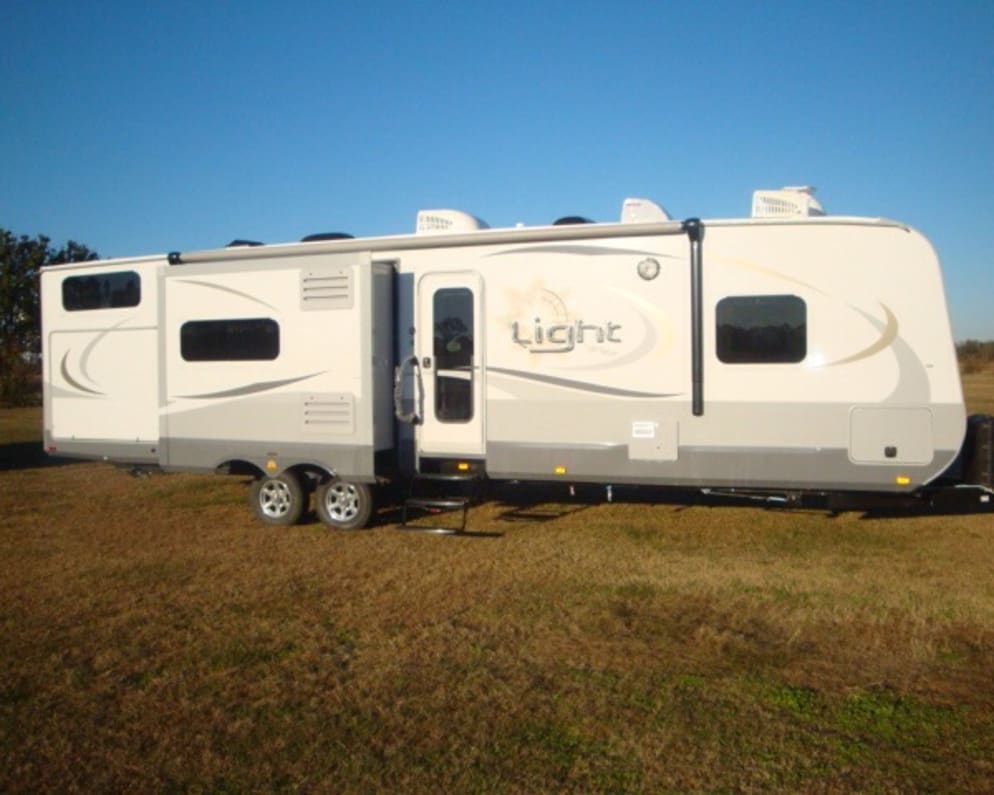 Passenger side with kitchen slide and outdoor kitchen