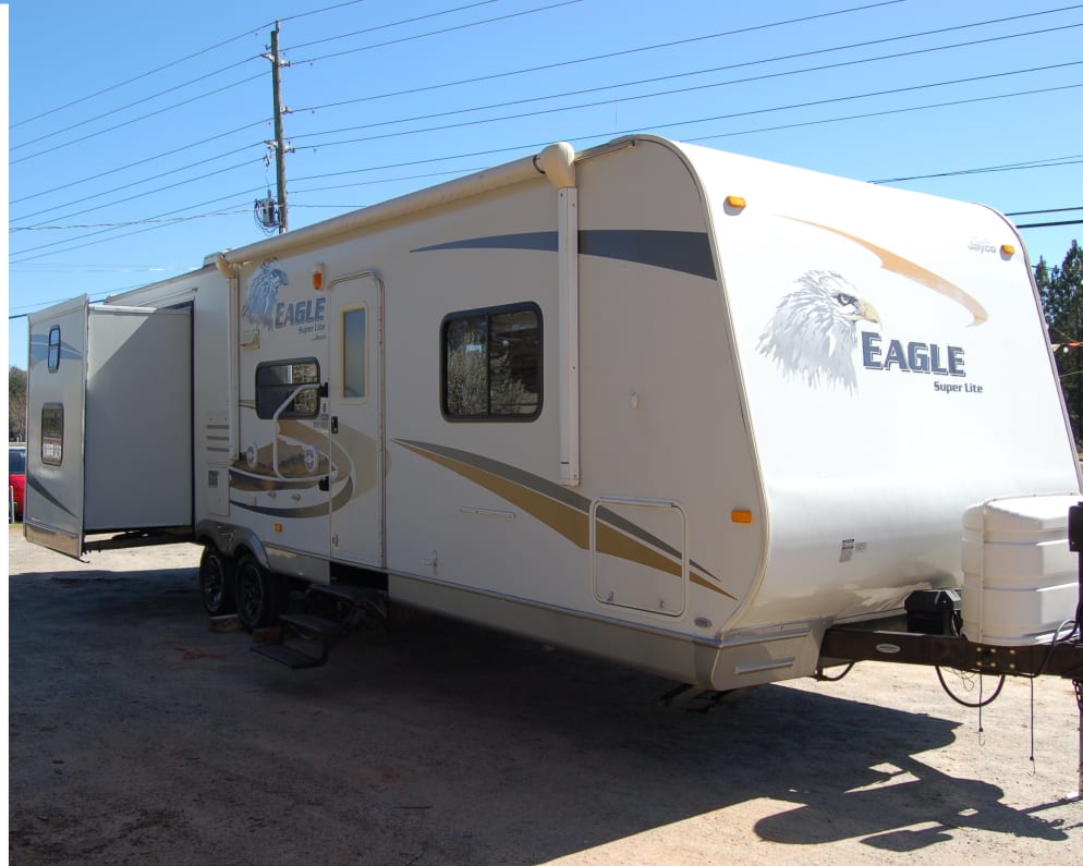 Spacious and fully stocked camper ready for weekends on the road or by the lake.