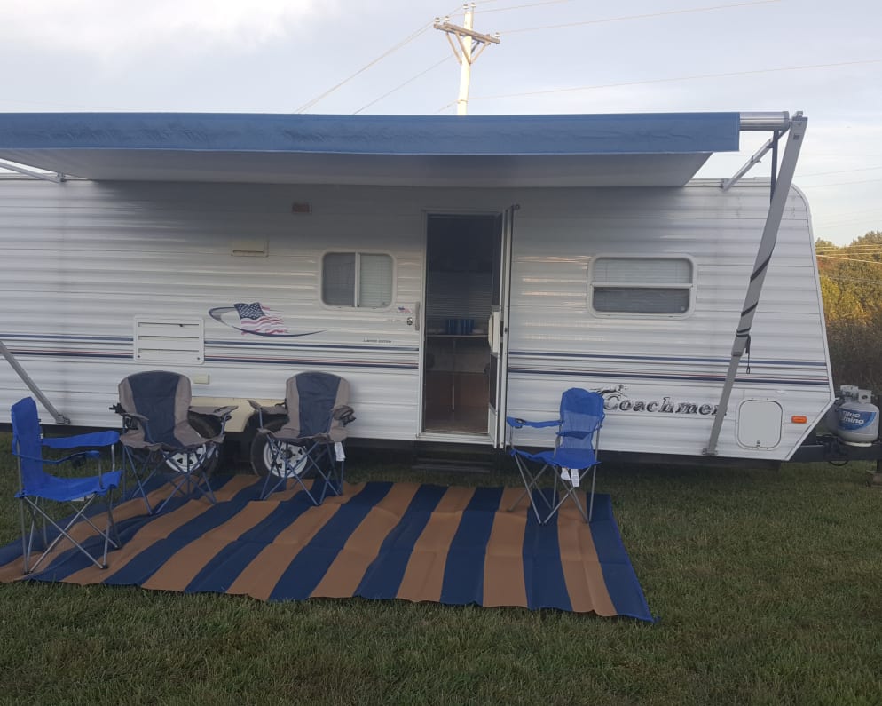 2003 Coachmen 24&#39; Area mat and chair. Two adult chairs and two kid chairs included.