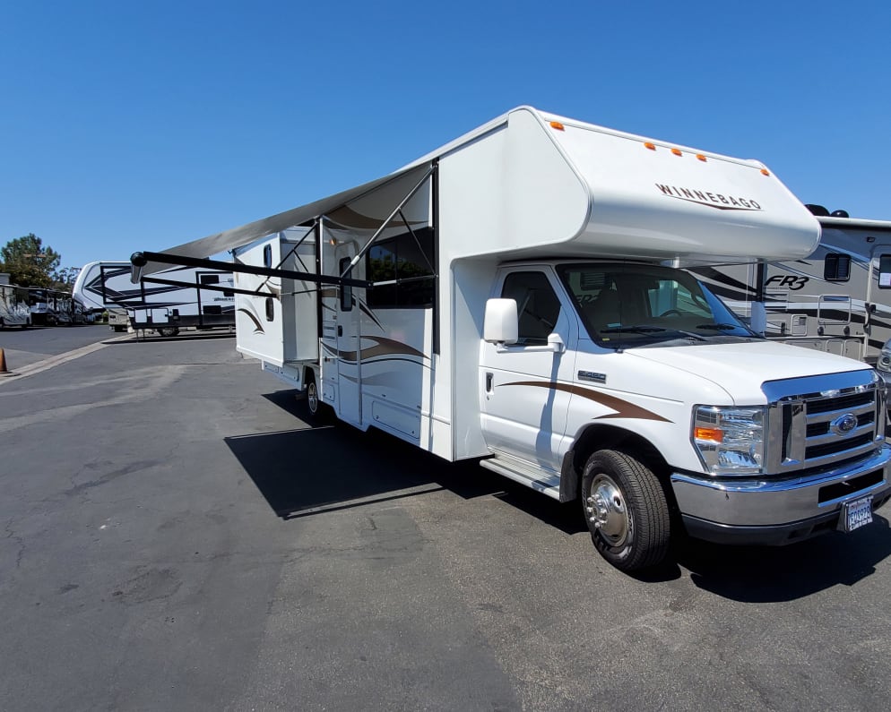 Electric awning which only takes seconds to set up and enjoy the shade. (2) electric slide outs turns your RV into a spacious home.