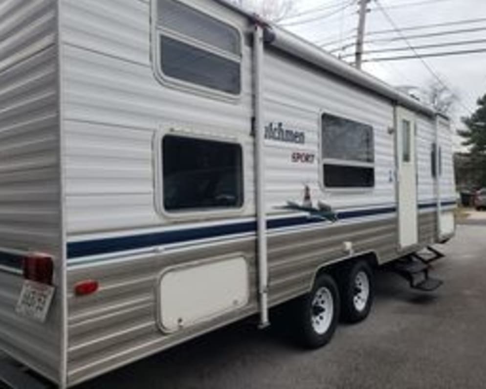 Dutchmen lite weight sport camper.  Can easily be pulled with a 1/2 ton pickup truck